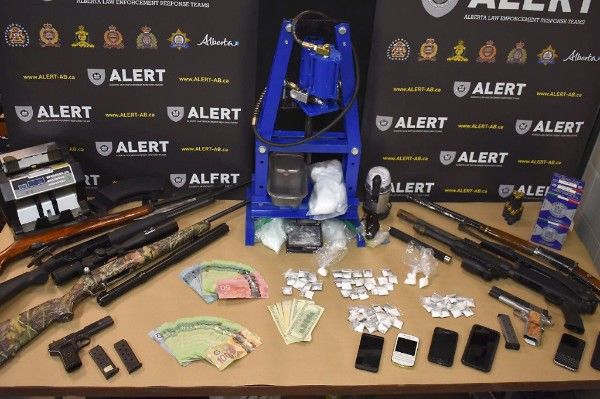 ALERT seizes drugs, weapons and cash from a Grande Prairie home, Wednesday, Aug. 1, 2018. 
