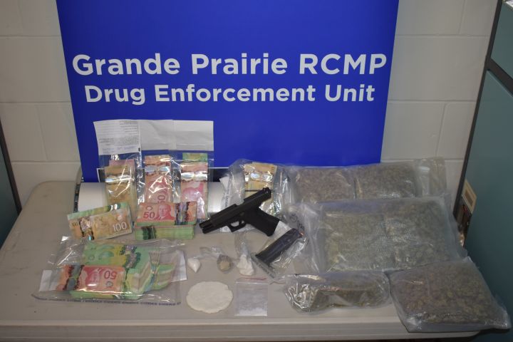 A loaded handgun was seized, along with a variety of different street drugs, when police executed search warrants at two homes in Grande Prairie, Alta. on Aug. 24, 2018.
