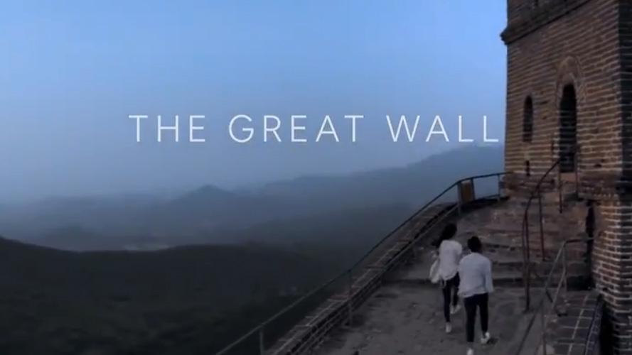 This image from video shows a couple entering a guardhouse on the Great Wall of China for an Airbnb sleepover promotion.