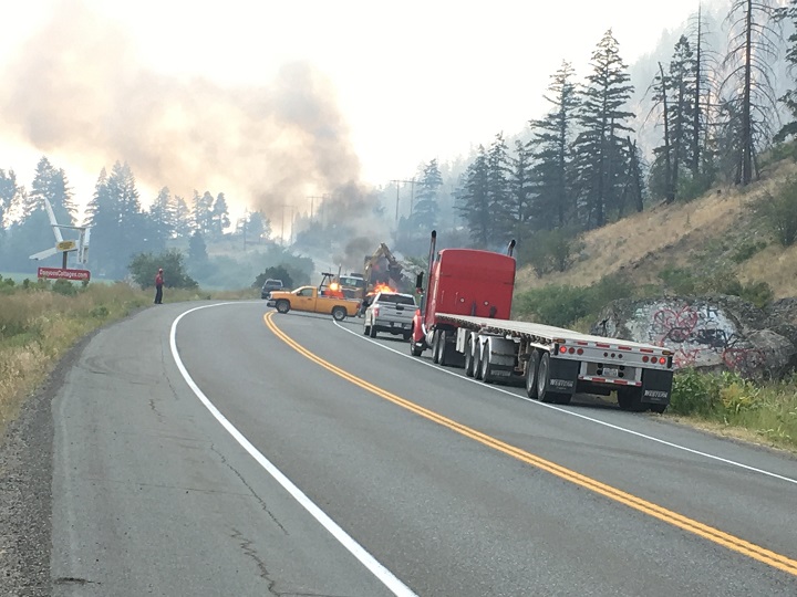 Smoke rises from a fire alongside Highway 3 near Hedley, B.C., on Wednesday afternoon.