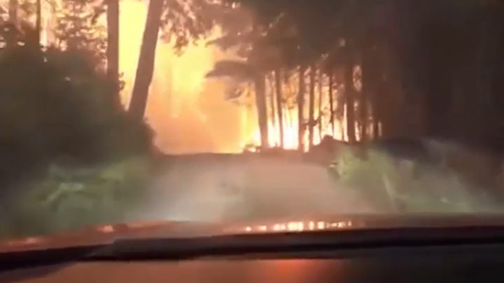 Justin Bilton and his father, Charles, headed into a wildfire at Glacier National Park in Montana on August 12, 2018.