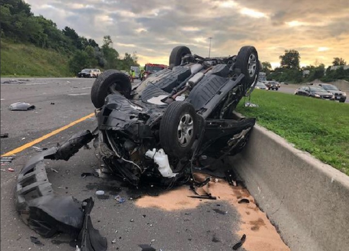 A car is turned over in a multi-vehicle crash on the westbound lanes of Hwy. 401 just east of Toronto on Aug. 31, 2018.