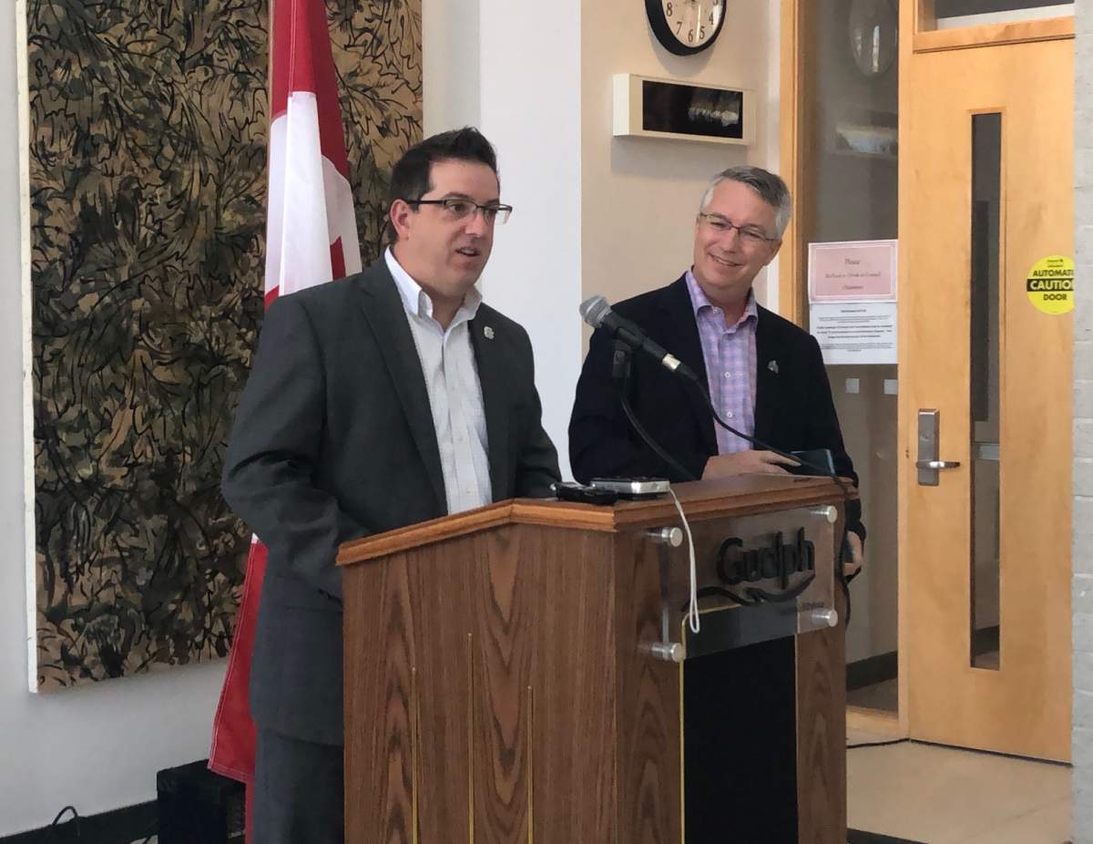 Guelph Mayor Cam Guthrie and MP Lloyd Longfield speak at a news conference at city hall.