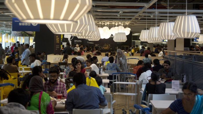 Indian customers sit at a restaurant inside IKEA’s first store in India as it opened in Hyderabad, India, Thursday, Aug. 9, 2018.