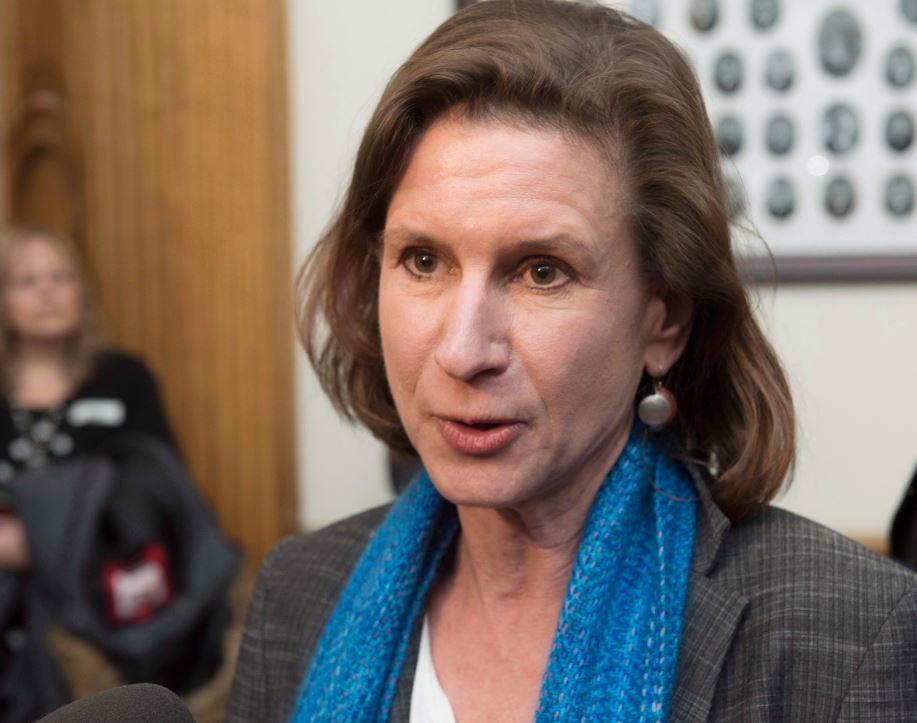 Jennifer McKenzie, leader of the New Brunswick NDP, reacts to the budget delivered by New Brunswick Finance Minister Cathy Rogers in the Legislature in Fredericton, N.B., on Tuesday, January 30, 2018. 