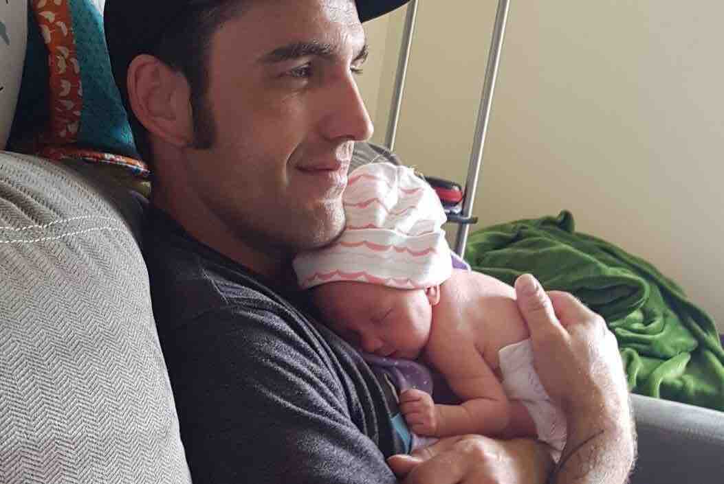 Jonathan Seidel with his newborn daughter.
