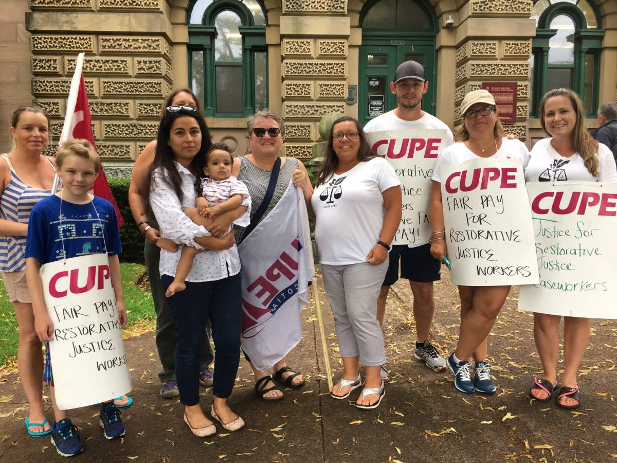 Restorative justice workers picket outside Provincial Court House.