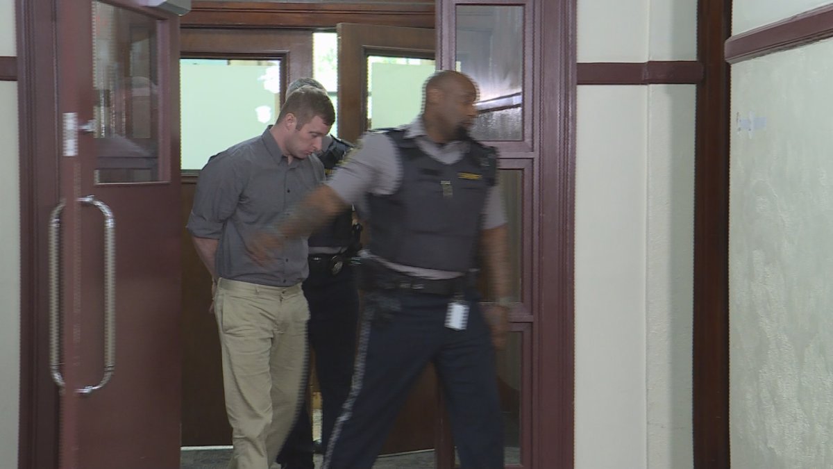 Matthew Percy is led out of court on Aug. 17, 2018.