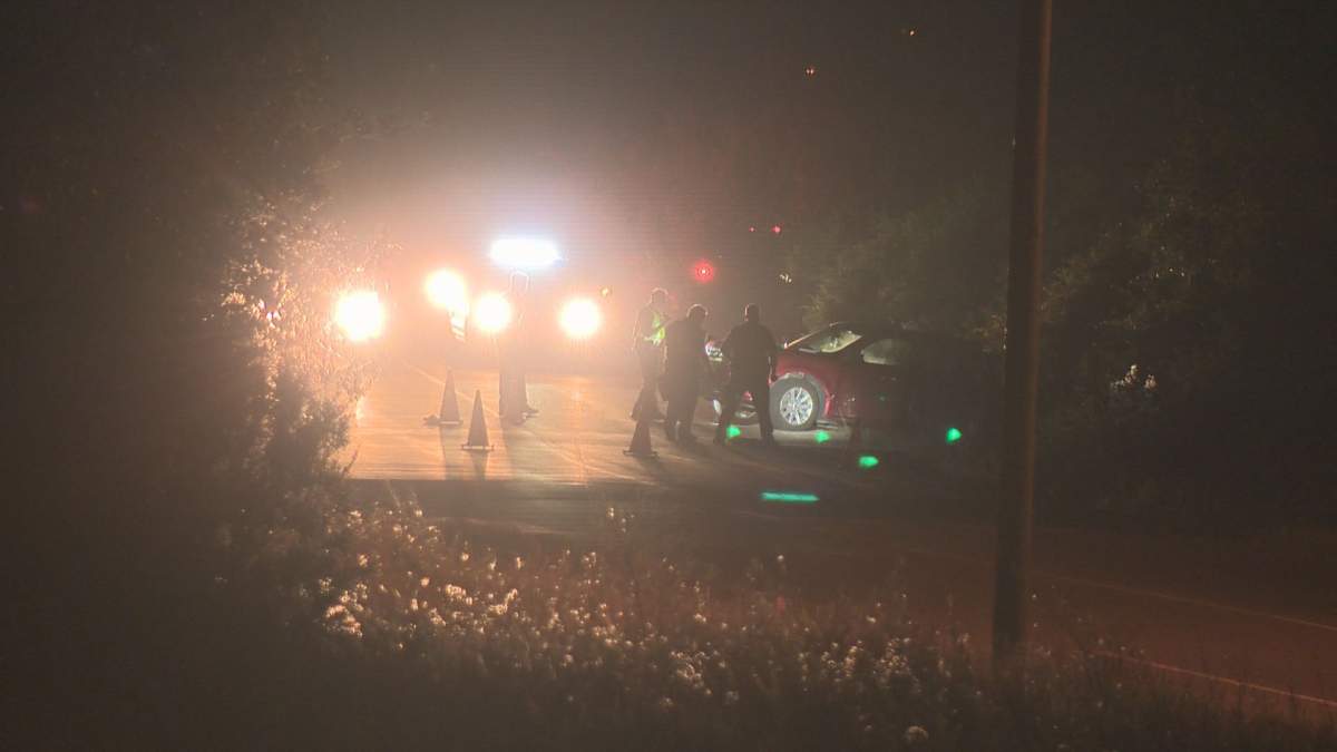 A red vehicle crashed on a rural stretch of 18 Street, between 153 Avenue and Anthony Henday Drive, on Wednesday, August 22, 2018.