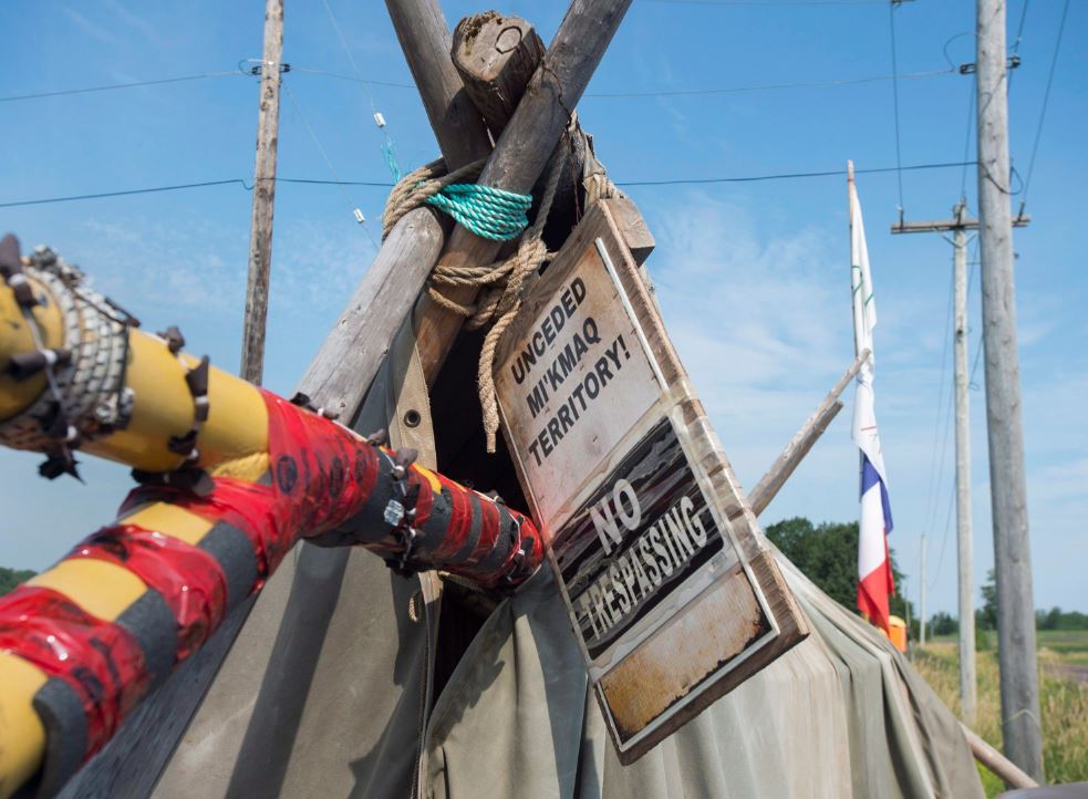 A sign marks the entrance to Mi’kmaq encampment near the Shubenacadie River, a 72-kilometre tidal river that cuts through the middle of Nova Scotia and flows into the Bay of Fundy, in Fort Ellis, N.S. on Tuesday, July 31, 2018.