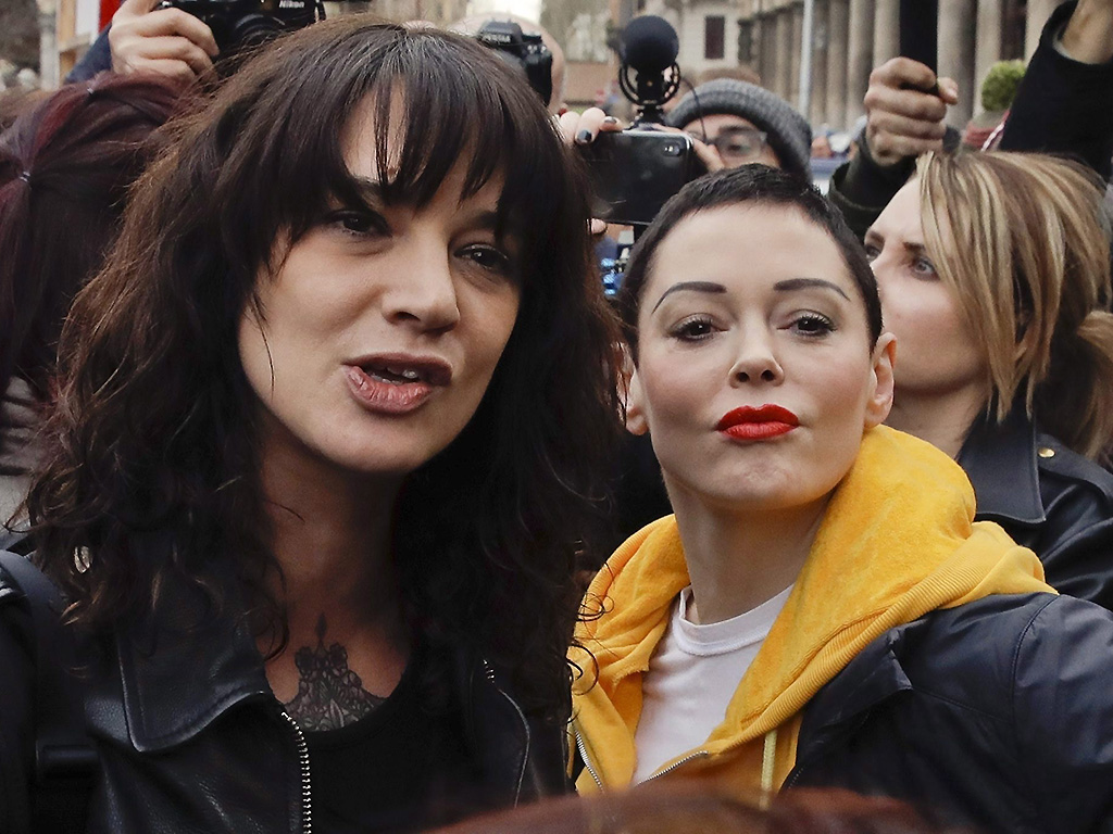 Asia Argento (L) and Rose McGowan mark International Women's Day in Rome on March 8, 2018. 