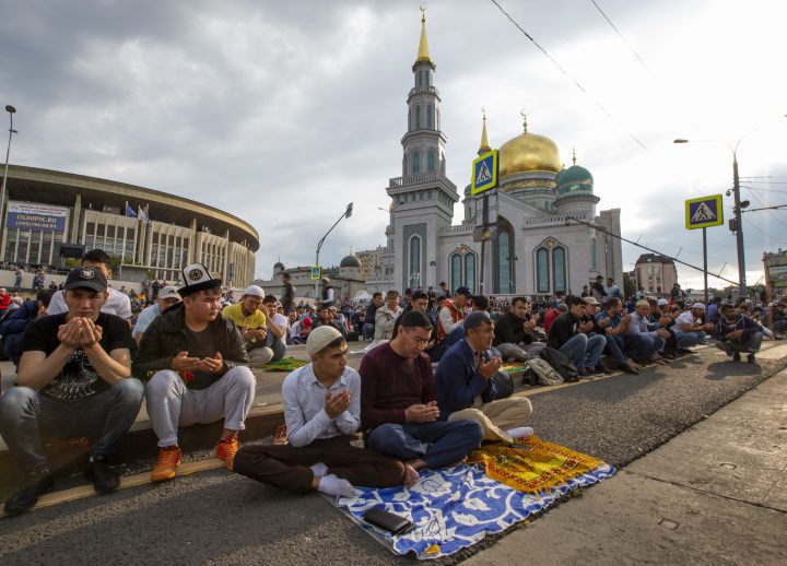 Muslims pray outside the Moscow Cathedral Mosque during celebrations of Eid al-Adha, a feast celebrated by Muslims worldwide, which Muslims in Russia call Kurban-Bairam, in Moscow, Russia, Tuesday, Aug. 21, 2018.