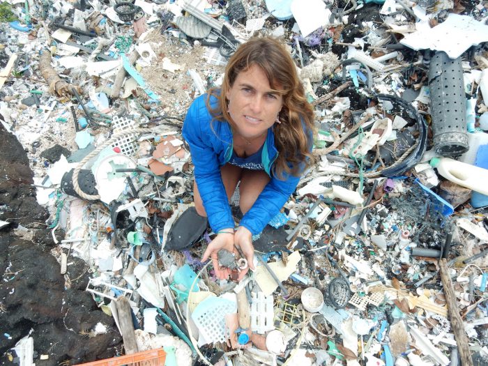 Dr. Sarah-Jeanne Royer holds microplastics at Kamilo Point on Big Island, Hawaii, on Feb. 14, 2018.