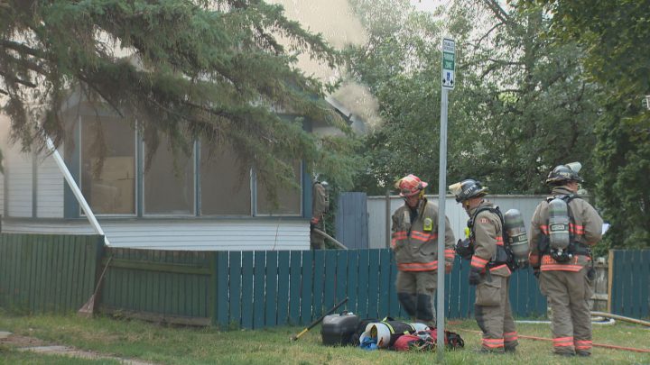 Saskatoon firefighters encountered heavy smoke when they entered the Avenue R South house, where a fire was burning in the basement.