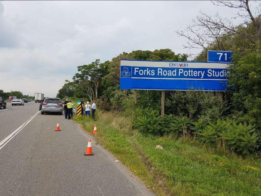 Police say a body was found in a vehicle on the QEW on Aug. 16.