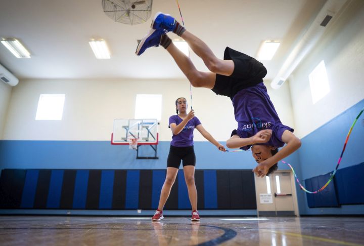 Owen Lucas from the Calgary Skip Squad does a flip while skipping during his routine in Calgary on Monday, July 30, 2018.