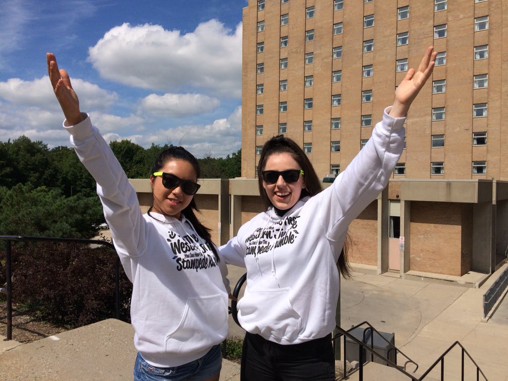 "Code Red" on the left, and "Camo" on the right are two student leaders (called Sophs) at Western University. They're ready to welcome first-year students to Saugeen-Maitland Hall after Soph training. 