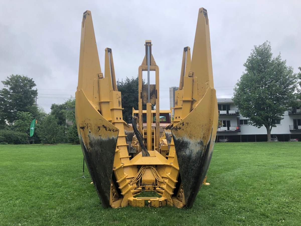 A tree spade machine is used to uproot trees. This one belongs to Manotick Tree Movers.