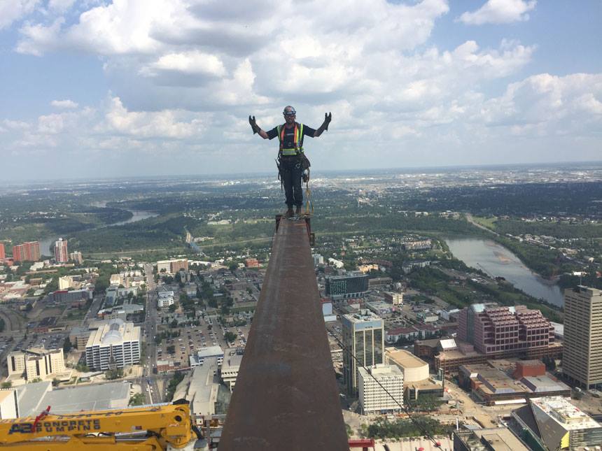 Ironworkers from Local 720 at the top of the under-construction Stantec Tower in downtown Edmonton, Alta.