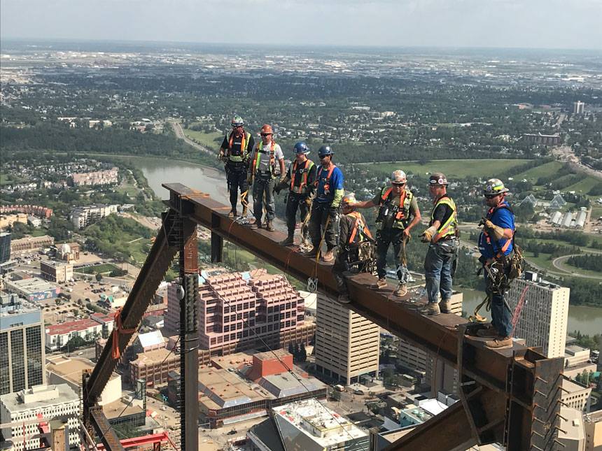Ironworkers from Local 720 at the top of the under-construction Stantec Tower in downtown Edmonton, Alta.