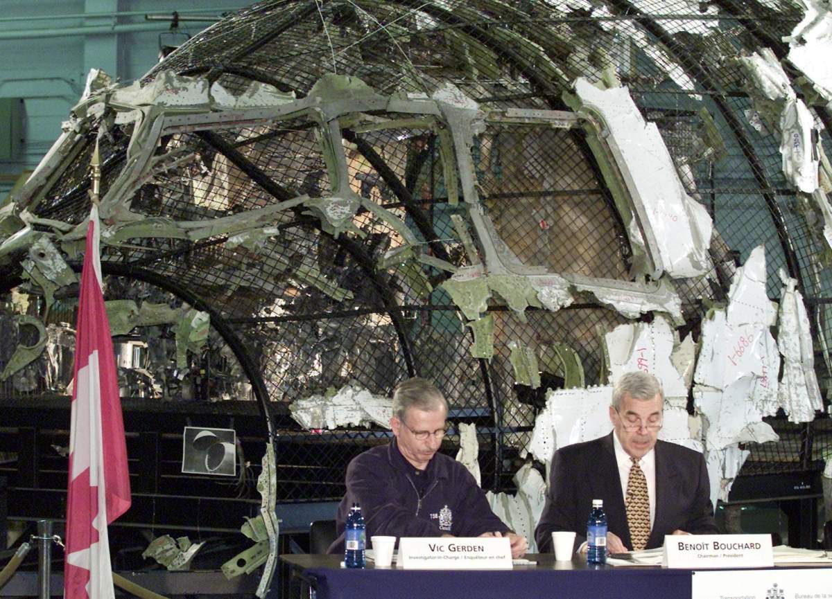 Transportation Safety Board Chairman Benoit Bouchard, right, and Chief Investigator Vic Gerden, release recommendations involving the 1998 Swissair Flight 111 disaster at a news conference in Halifax on Monday, Dec. 4, 2000.