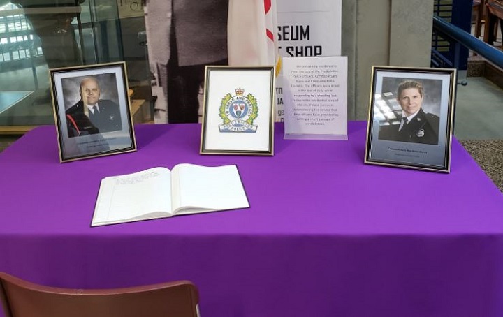Books of condolences have been placed in the lobby of Toronto police headquarters.