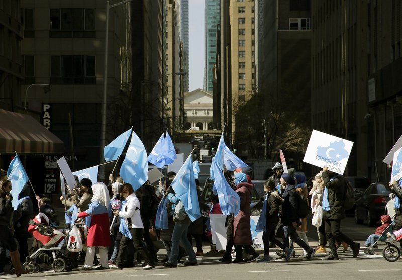 Uighurs and their supporters march to the Permanent Mission of China to the United Nations in New York, Thursday, March 15, 2018. 
