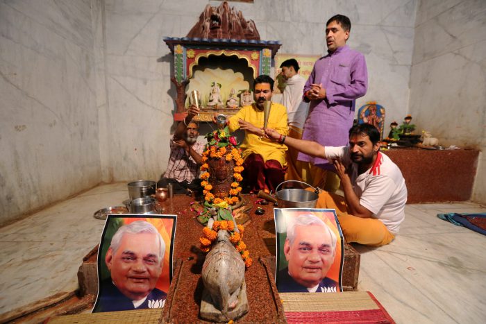 Indian people are shown at a vigil for former Indian prime minister Atal Bihari Vajpayee at a shrine in Bhopal, India, 16 August 2018.