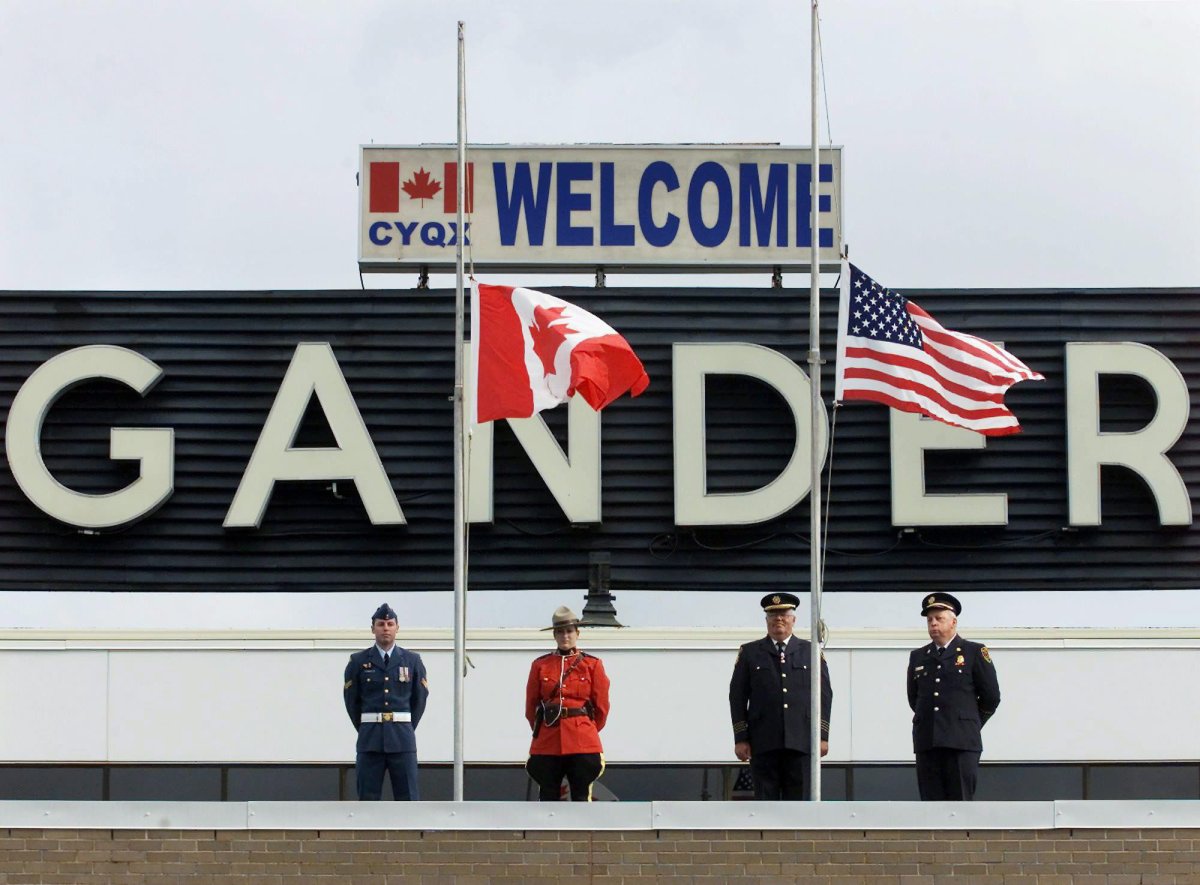 The Canadian and United States flags were lowered to half mast  at a commemorative ceremony to mark the first anniversary of the terrorist attacks against the U.S., in Gander, Nfld. on Wednesday, Sept. 11, 2002. 