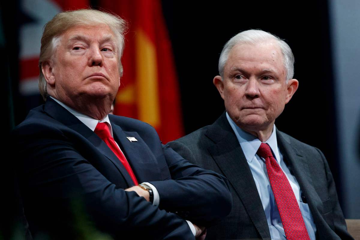 President Donald Trump sits with Attorney General Jeff Sessions during the FBI National Academy graduation ceremony, Friday, Dec. 15, 2017, in Quantico, Va.