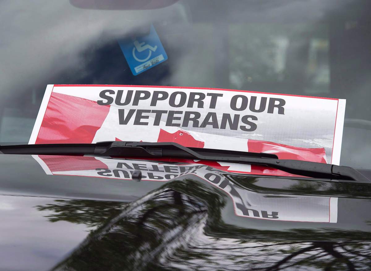 A sign is placed on a truck windshield as members of the advocacy group Banished Veterans protest outside the Veterans Affairs office in Halifax on Thursday, June 16, 2016.