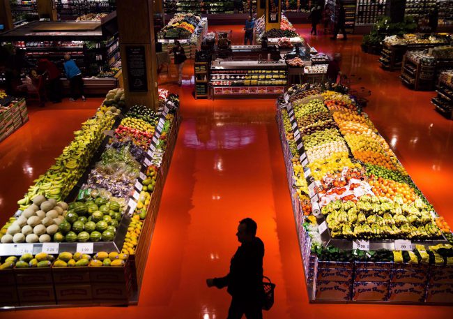 People shop in the produce area at a Loblaws store in Toronto on May 3, 2018. 


