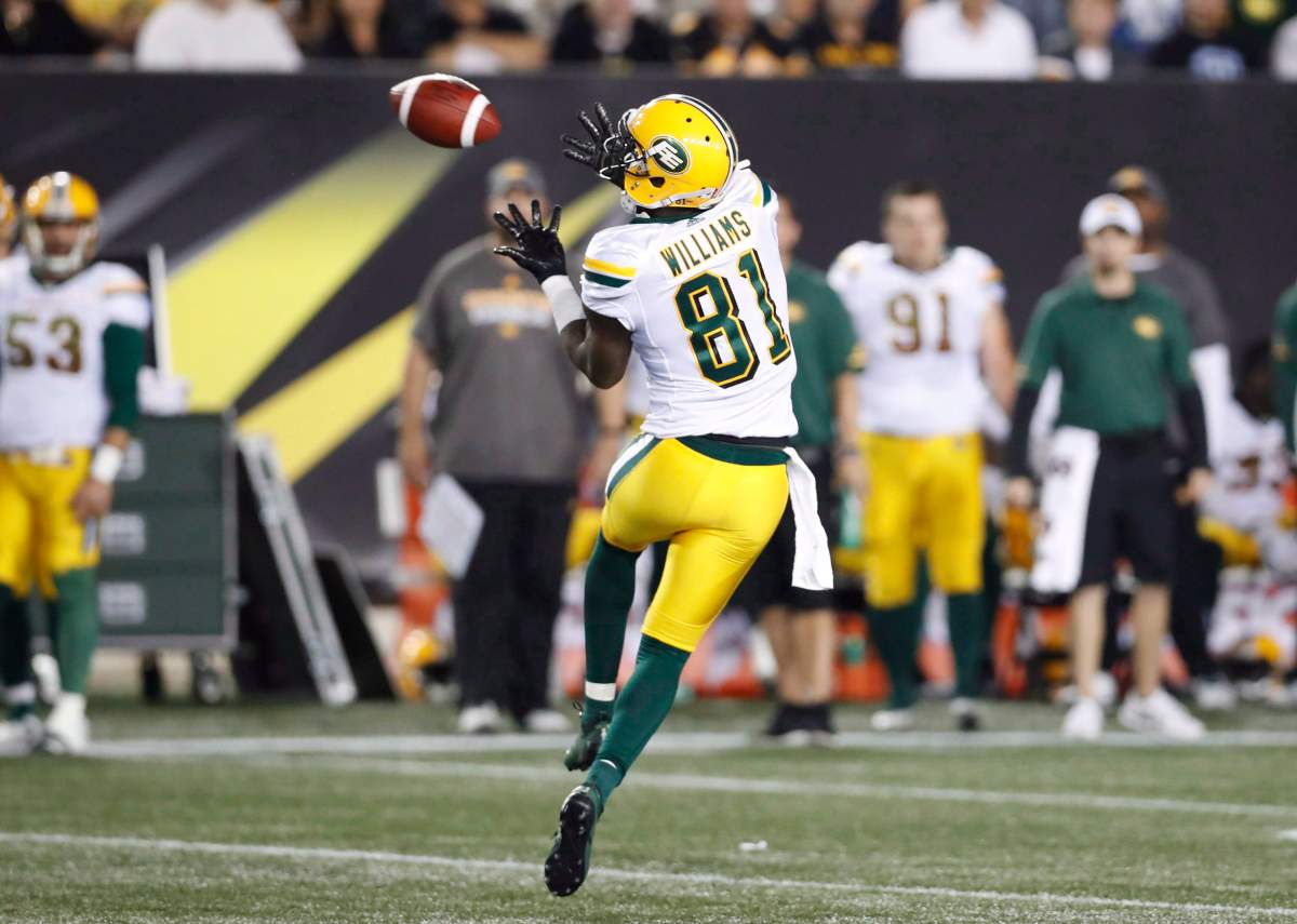 Edmonton Eskimos' D'haquille Williams receives a pass before running it in for a touchdown against the Hamilton Tiger-Cats during the first half of CFL football action in Hamilton, Ontario on Thursday August 23, 2018. 