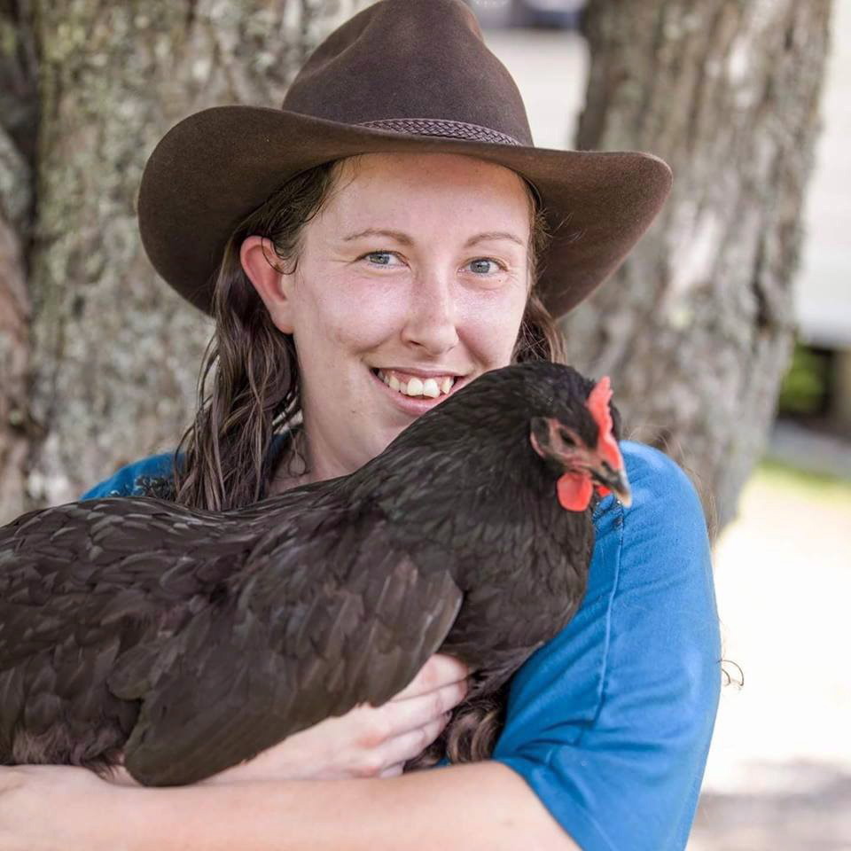 Kyrie Ann Neves poses with one of her chickens in this undated handout photo.