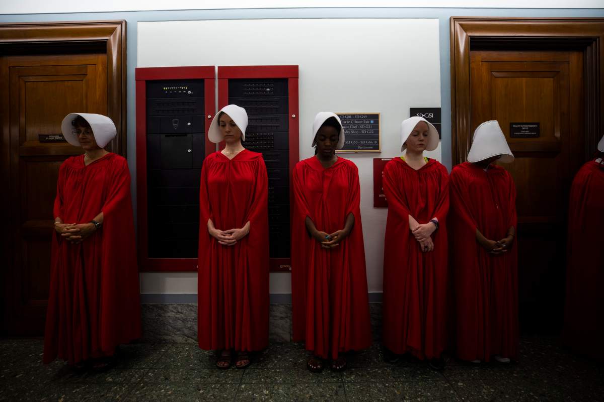 Protestors dressed in costumes from the dystopian novel The Handmaid’s Tale gather outside the Senate confirmation hearing of circuit judge Brett Kavanaugh to be an Associate Justice of the Supreme Court of the United States in the Hart Senate Office Building in Washington, D.C., on Sept. 5, 2018.