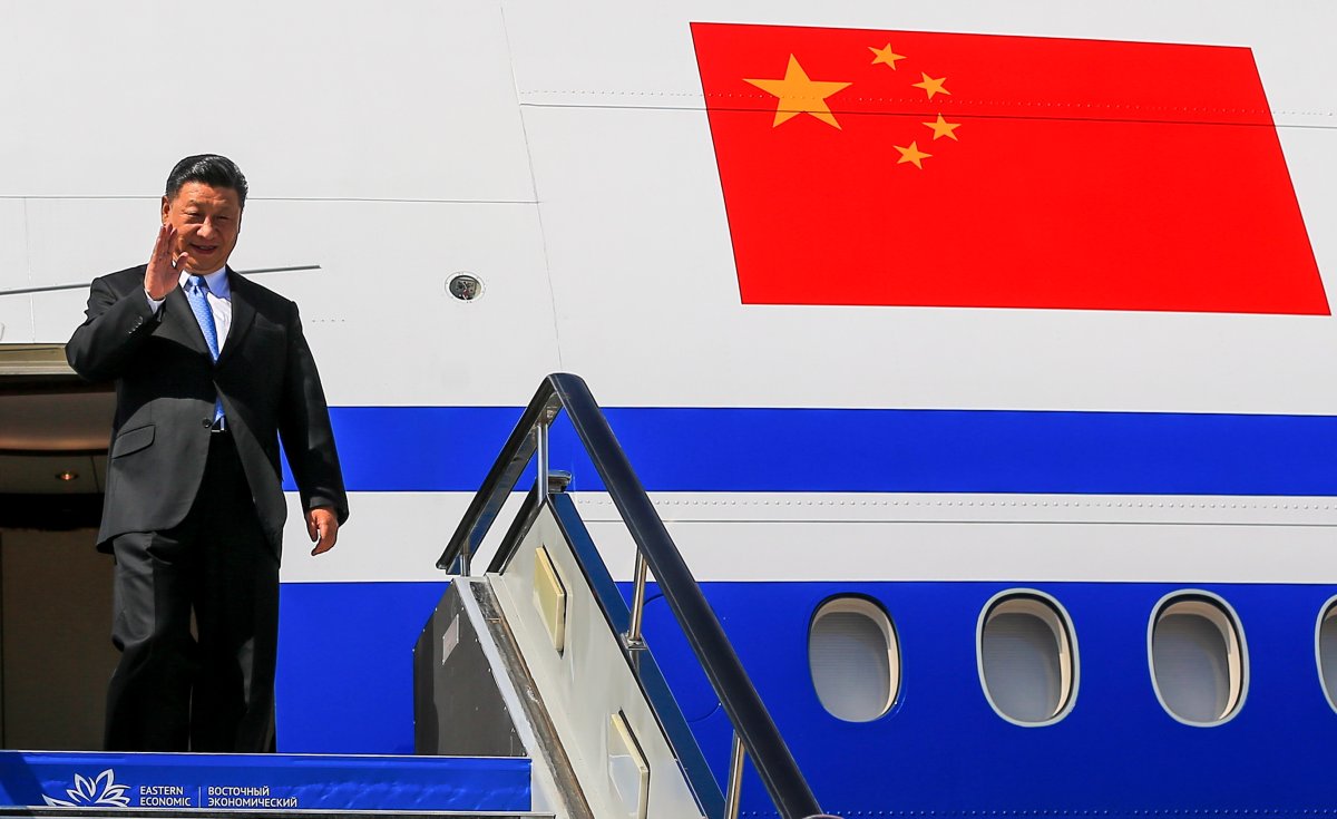 Chinese President Xi Jinping gestures as he arrived at Vladivostok, Russia, to attend the Eastern Economic Forum, Tuesday, Sept. 11, 2018.