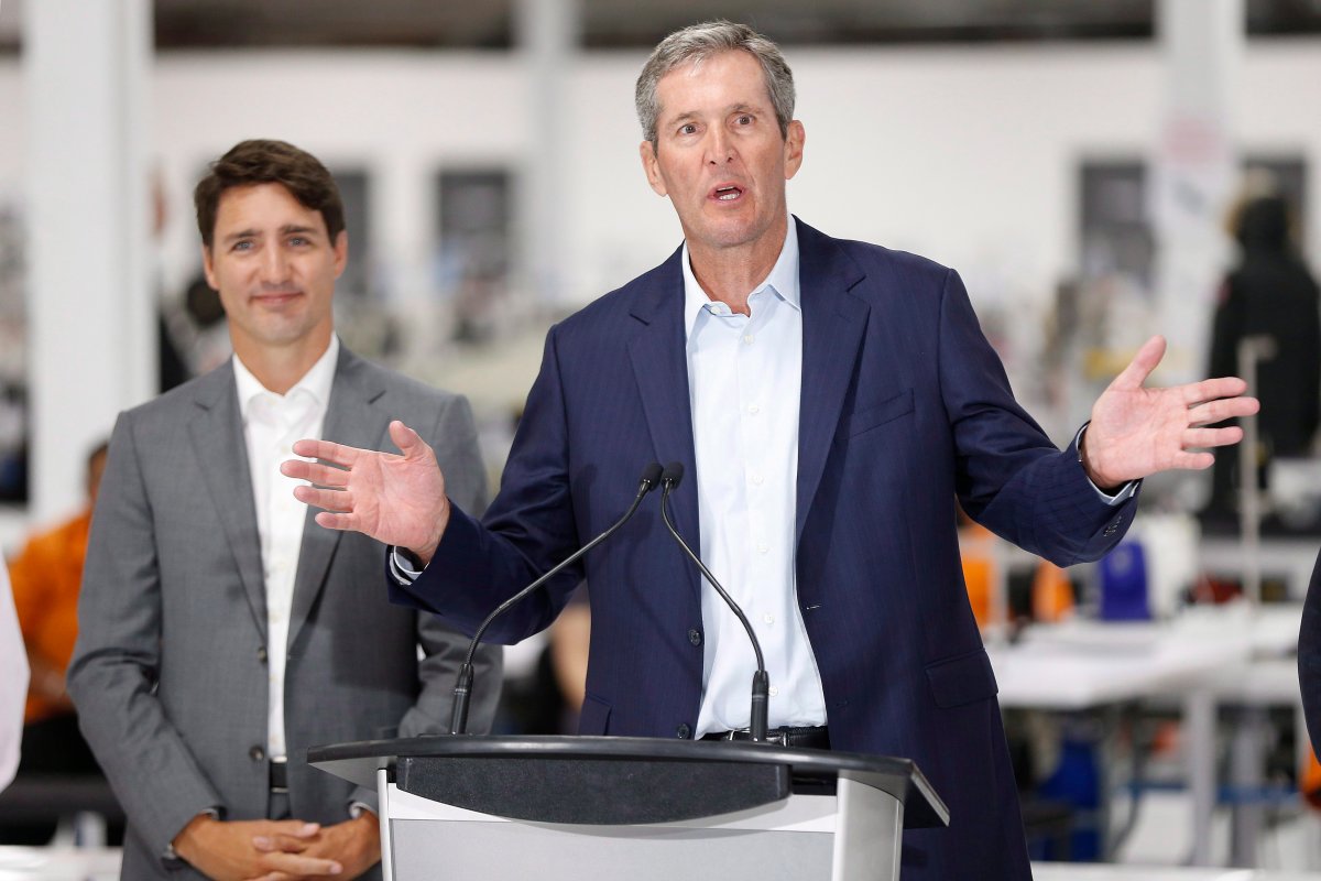 Prime Minister Justin Trudeau listens in as Manitoba Premier Brian Pallister speaks at a new 700 employee Canada Goose manufacturing facility in Winnipeg, Manitoba Tuesday, September 11, 2018.