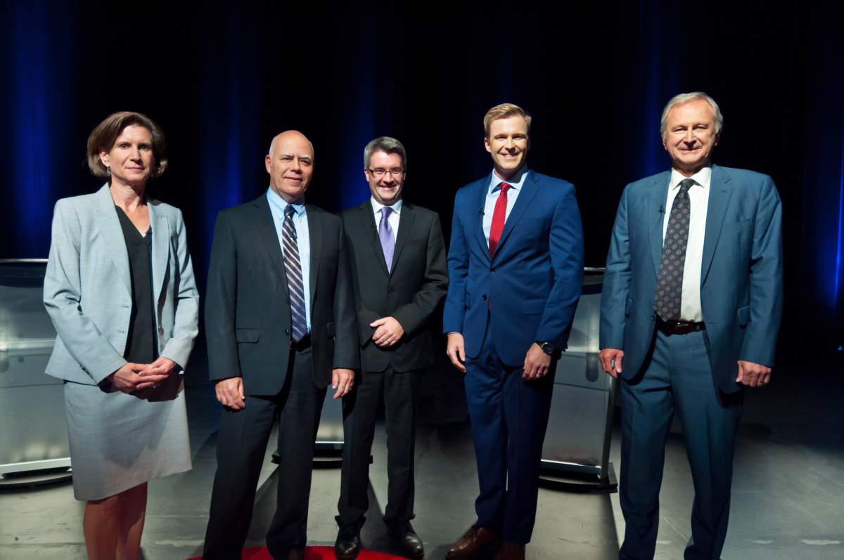 NDP Jennifer McKenzie, left to right, Green Party David Coon, People's Alliance Kris Austin, Liberal Brian Gallant, PC Blain Higgs pose for photos before the start of the New Brunswick leaders debate in Riverview, New Brunswick on Wednesday September 12, 2018.
