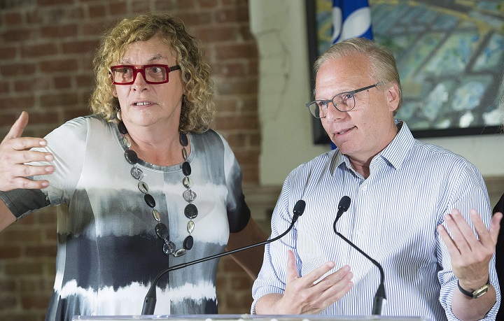 Parti Québécois Leader Jean-François Lisée and candidate Michelle Blanc speak to reporters during a campaign stop in Montreal, Saturday, September 15, 2018. 