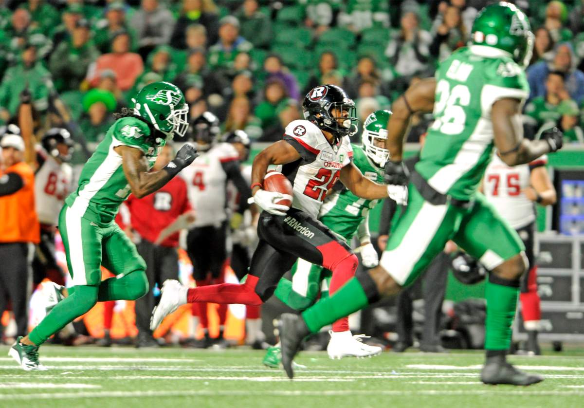 Ottawa Redblacks running back William Powell outruns Saskatchewan Roughrider defensive back Ed Gainey for a touchdown during second half CFL action at Mosaic Stadium in Regina on Saturday, Sept. 15, 2018.