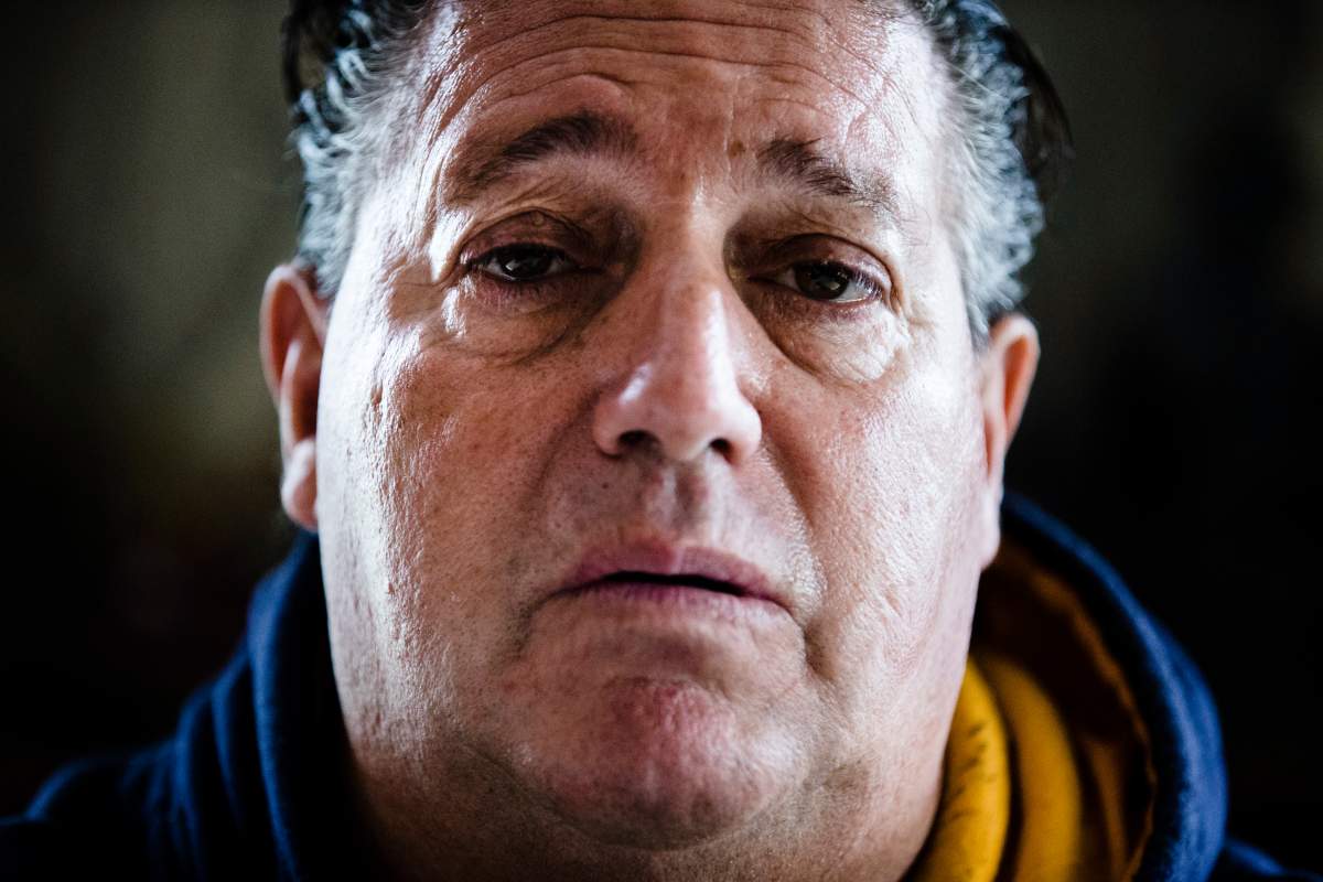 Anthony Torres poses for a photograph at his brother's home in Atco, N.J., Monday, Sept. 17, 2018. Torres says he was the rider caught shaving on a New Jersey Transit train in a video that went viral. 