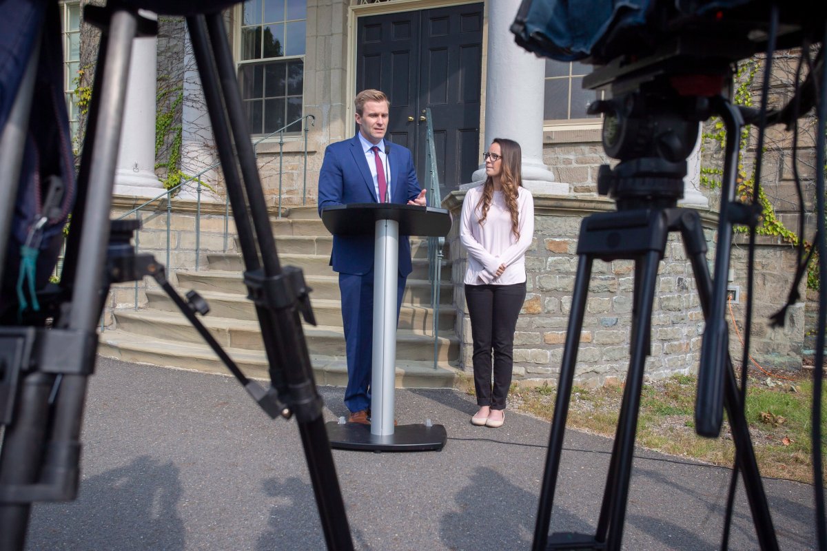 New Brunswick Liberal Leader Brian Gallant and wife Karine Lavoie, right, addresses the media after meeting with Lieutenant Governor of New Brunswick Jocelyne Roy-Vienneau, in Fredericton on Tuesday, Sept. 25, 2018. 