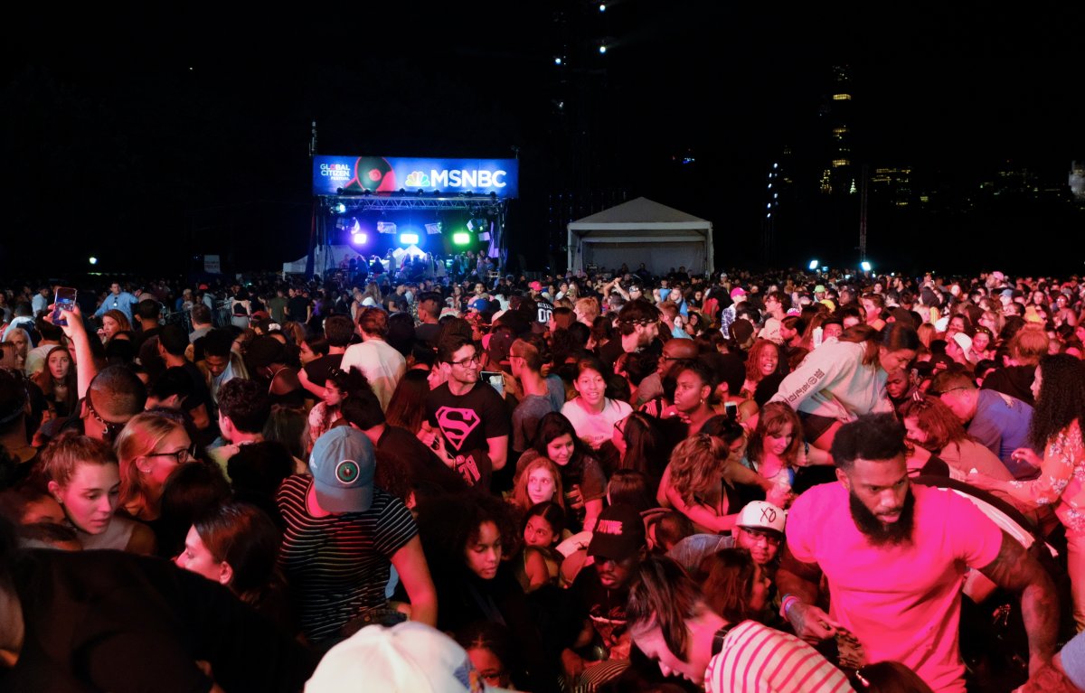 Concert goers surge forward after a barricade got knocked over at the 2018 Global Citizens Festival in Central Park on Saturday, Sept. 29, 2018, in New York.