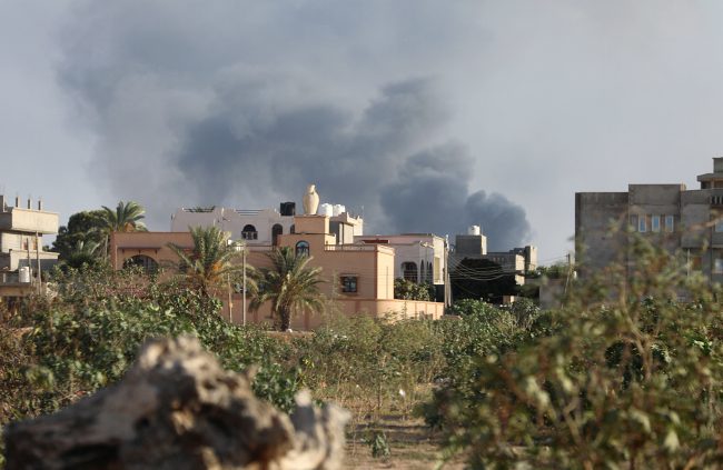 Smoke rises during heavy clashes between rival factions in Tripoli, Libya, August 28, 2018.


