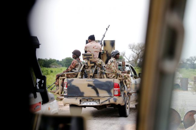 A Nigerian army convoy vehicle drives ahead with an anti-aircraft gun, on its way to Bama, Borno State, Nigeria Aug. 31, 2016.