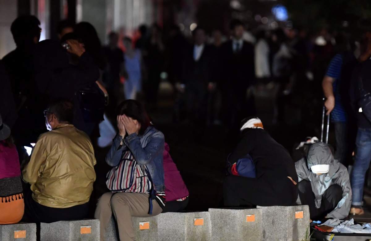People react during blackout after a powerful earthquake hit the area in Sapporo, Japan in this photo taken by Kyodo September 6, 2018.