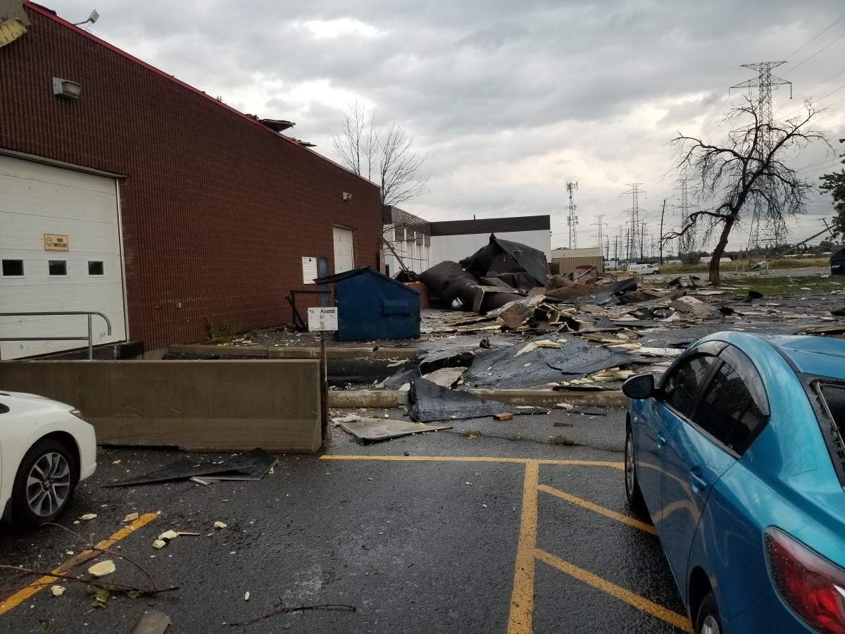 Damage can be seen behind to FiiT House on Colonnade Road after last Friday's tornado in Nepean.
