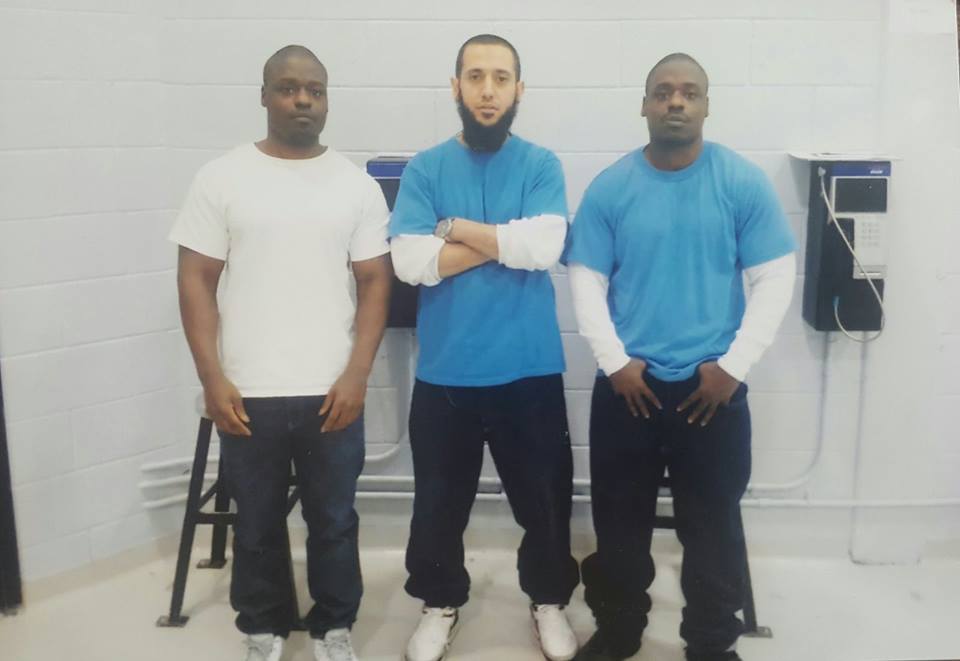 Zakaria Amara, centre, in a photo posted on a Facebook page that has been removed.