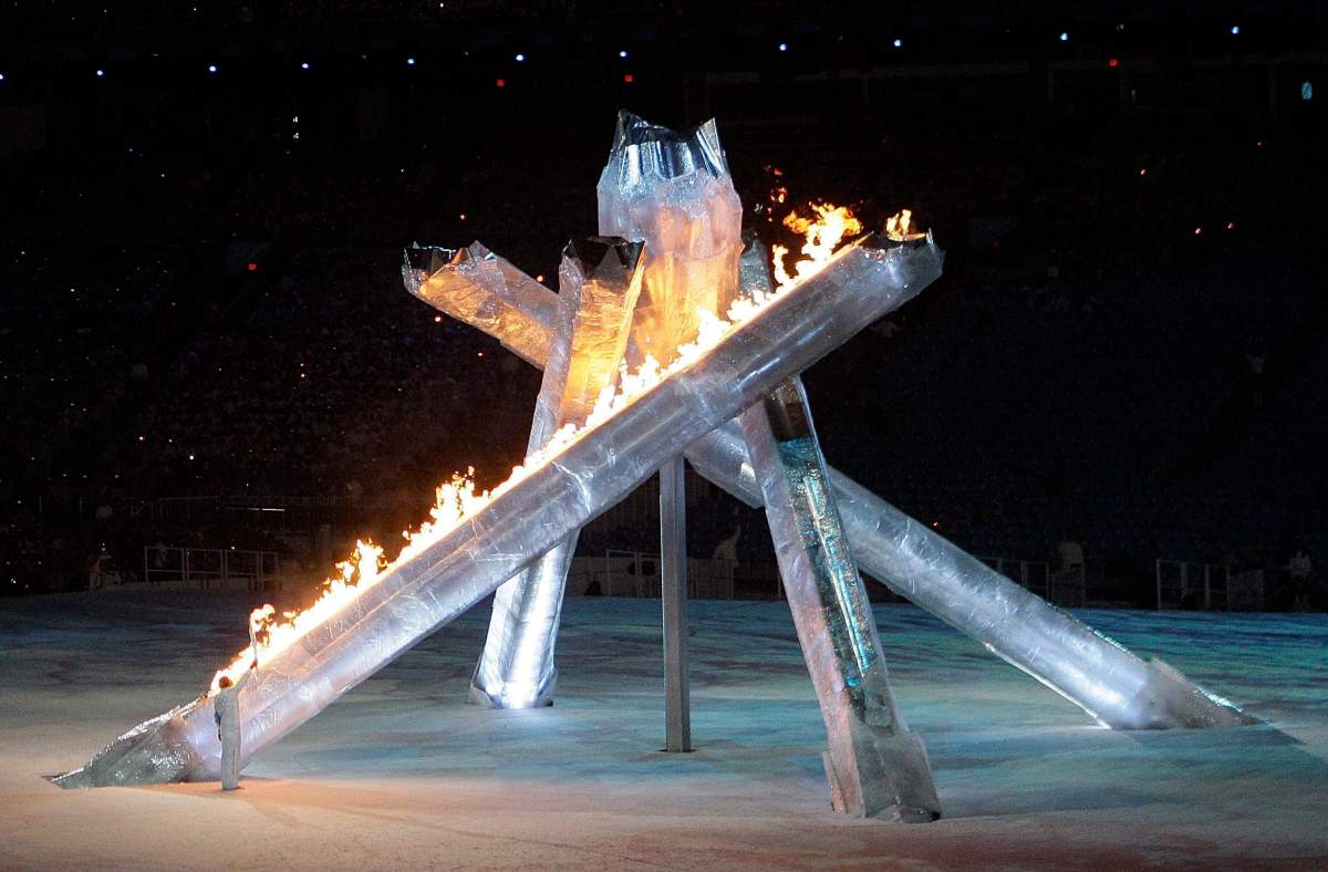 The Canadian Olympic torch is lit by Canadian speed skater Catriona Le May Doan during the closing ceremony for the Vancouver 2010 Olympics in Vancouver, British Columbia, Sunday, Feb. 28, 2010. 