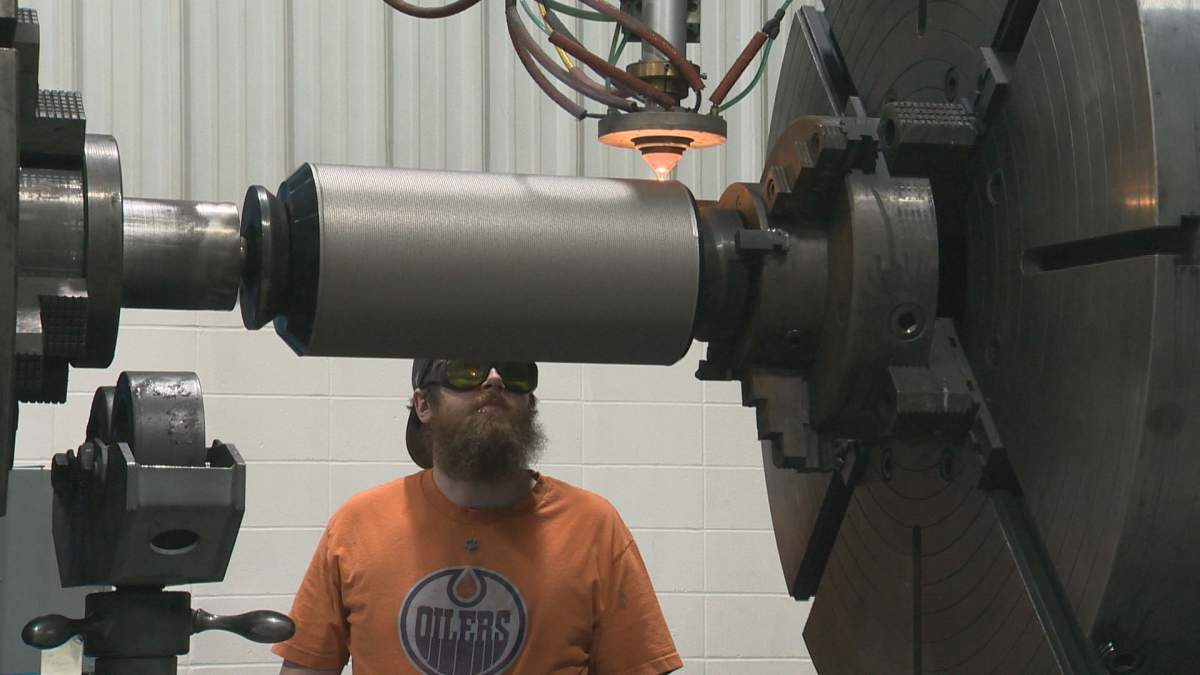 An employee at Apollo Machine in Leduc, Alta., processes steel for use in down-hole drilling.